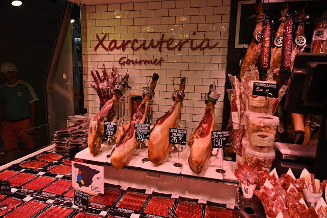 Hanging jamons (hams) in a market in Barcelona, Spain