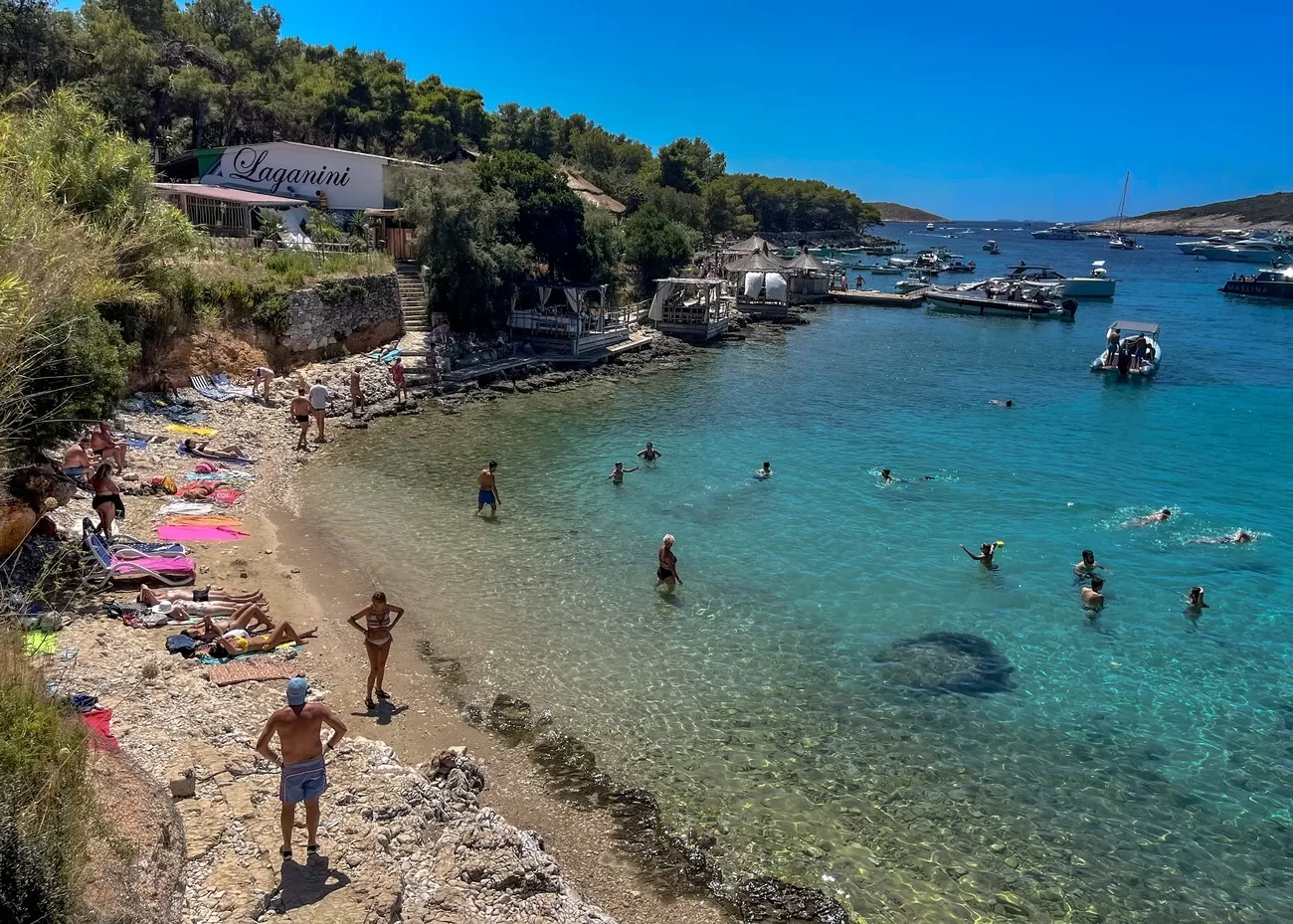 Rocky beach in Palmiลพana, Croatia