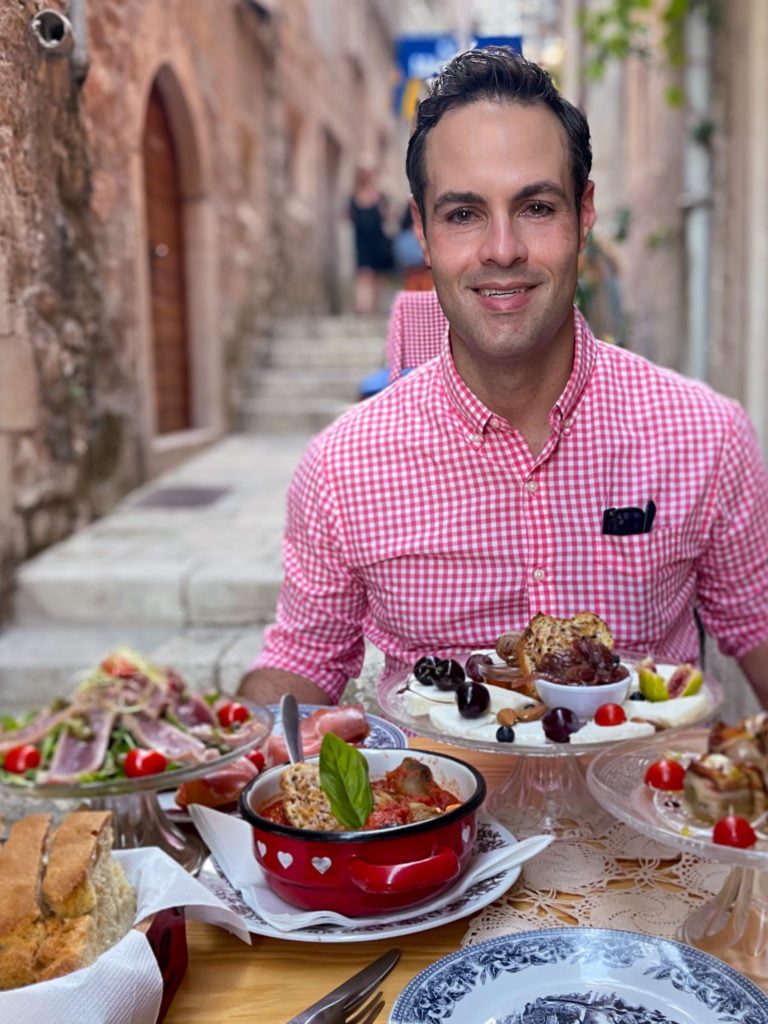 Jeff from Adventurous Tastes dining at Lole, a Korcula alleyway restaurant in Croatia