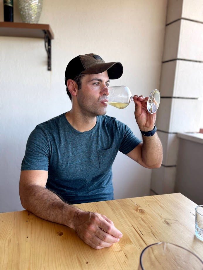 Jeff from Adventurous Tastes drinking white wine during 2 days in Korcula, Croatia