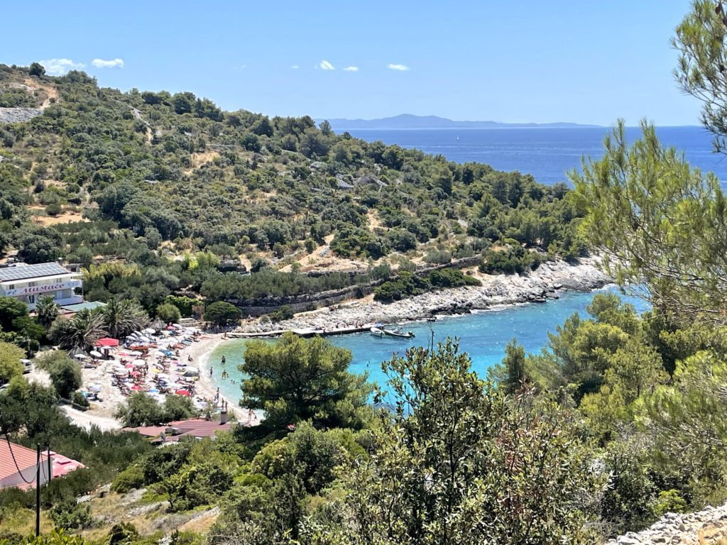 Looking down on rocky Croatian beach and subathers