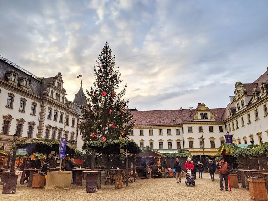 Regensburg is home to one of the best Christmas markets in Europe. Christmas tree in palace courtyard in Germany photo credit: Adventurous Tastes