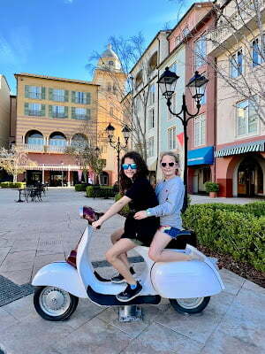 Two little girls on a vespa at Portofino Bay Resort