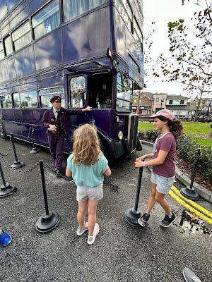 Two little girls banter with the Knight Bus at Universal Studios Florida