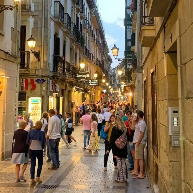 Busy street in early evening in San Sebastian, Spain