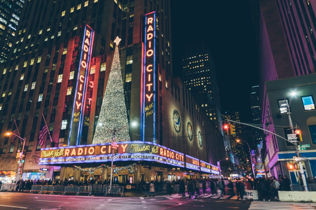 A Rockette's show. atRadio City Music Hall is a must do when visiting NYC at Christmas | Photo by Goh Rhy Yan on Unsplash