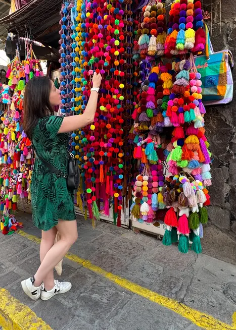 Woman looking at crafts i Mexican market