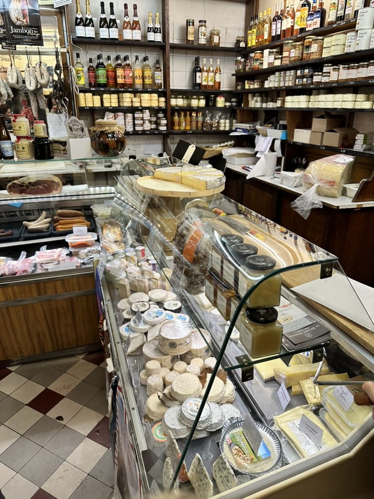 Cheese in a case at a fromagerie in Paris