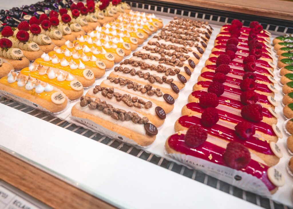 Brightly colored pastries in a case - eating sweets is a given when visiting Paris with kids