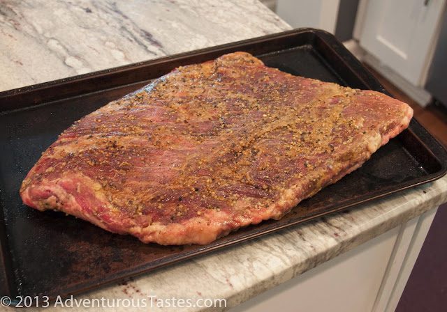 Seasoned raw brisket ready for smoking in the masterbuilt smoker
