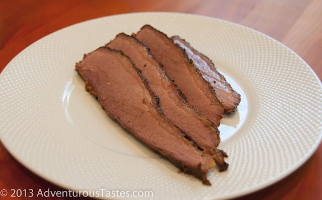 Sliced beef brisket on a plate - cooked in a masterbuilt smoker