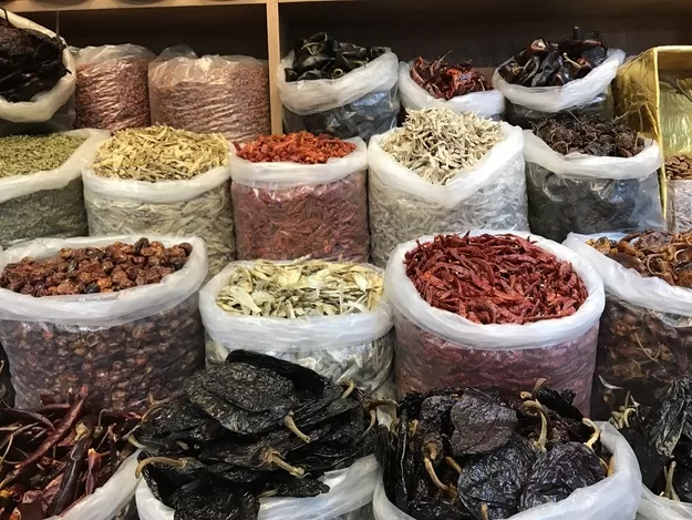 Rows of peppers lined up for sale at a Mexico City market