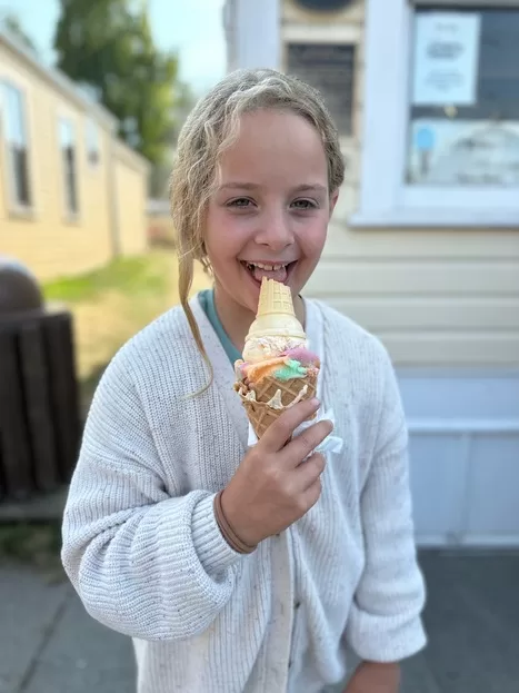 Little blond girl eating on ice cream on a Whidbey Island day trip from Seattle