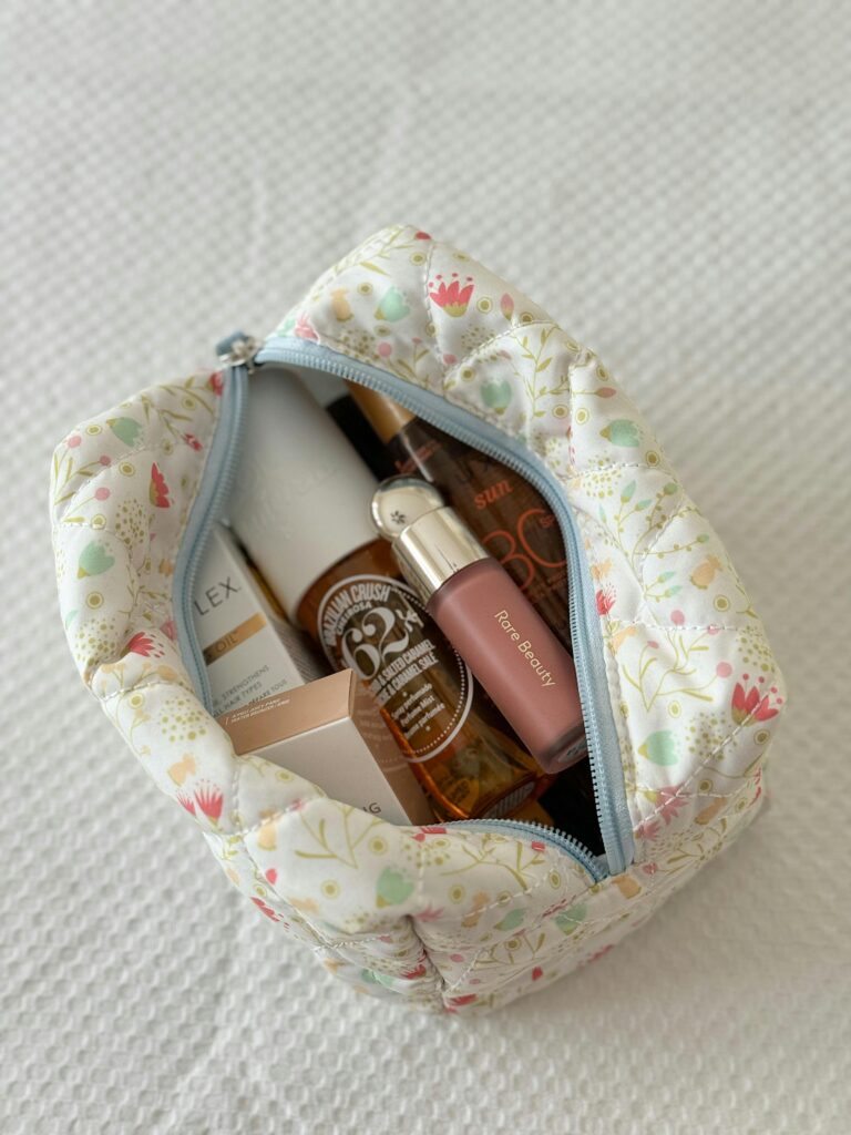 Toiletries bag filled with beauty products from the Sephora Sale