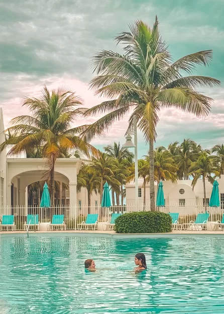 Two girls in a pool at Isla Bella in Marathon Key, FL, a great spring break destination for a family travel adventure.