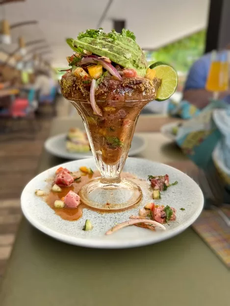 Cevich in a glass overflowing with seafood at Hotel Xcaret in Mexico