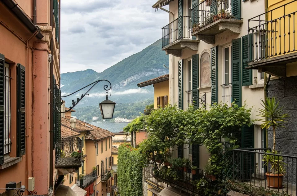 Mountain and lake view in the distance and colorful buildings in the foreground in Lake Como a perfect destination for your trip to Italy