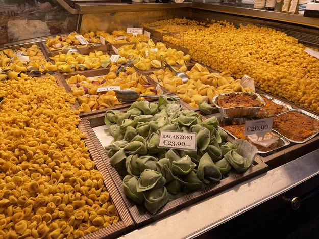 Array of multicolored pastas in Bologna, a perfect stop for foodies on a trip to Italy