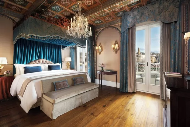 Luxurious bedroom at St. Regis Hotel in Florence, one of the best places to stay in Tuscany