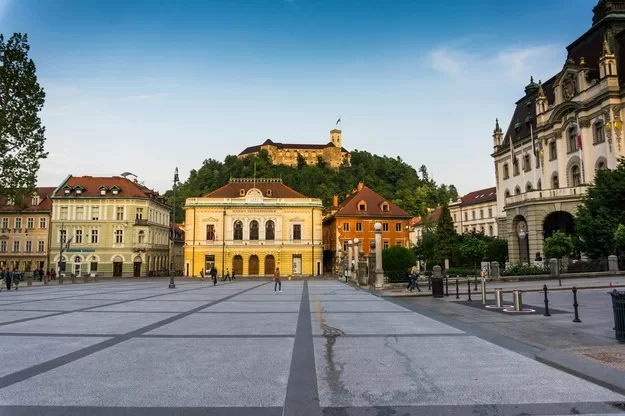 town square with castle looming above in Ljubliana, Slovenia
