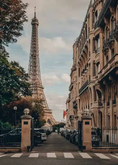 View of the Eiffel Tower from a Parisian street - a must-see when in Paris with kids