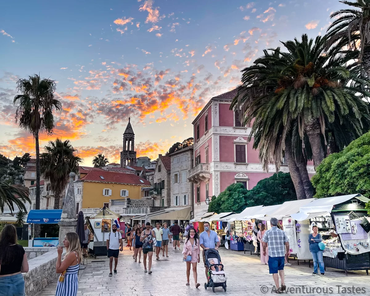 People strolling in Hvar, Croatia and sunset